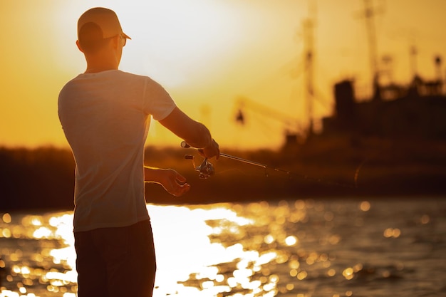 Young man fishing at sea