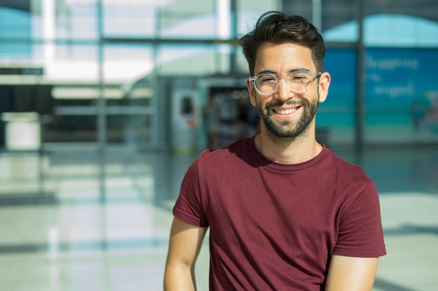 Young man happy and laughing in the airport