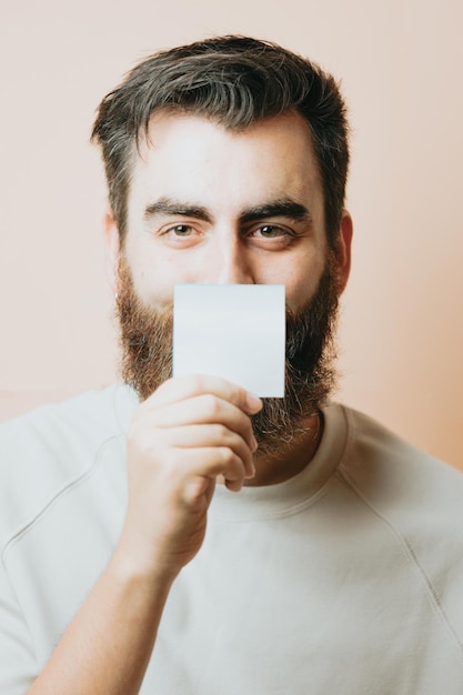 Young man holding a blank card to put your text psychiatric help concept You are not aloneMental health self help concept Ask for help talk to someone Psychology