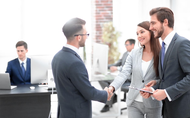 Young man introducing himself at meeting to his partners