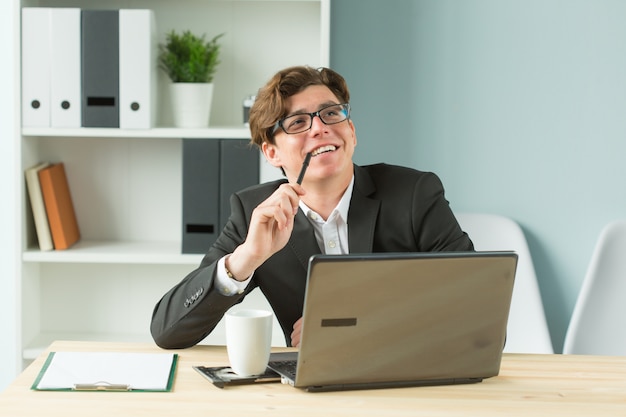 Young man is fun and enthusiastic working in the office