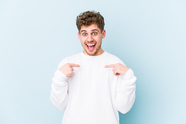 Young man isolated on blue