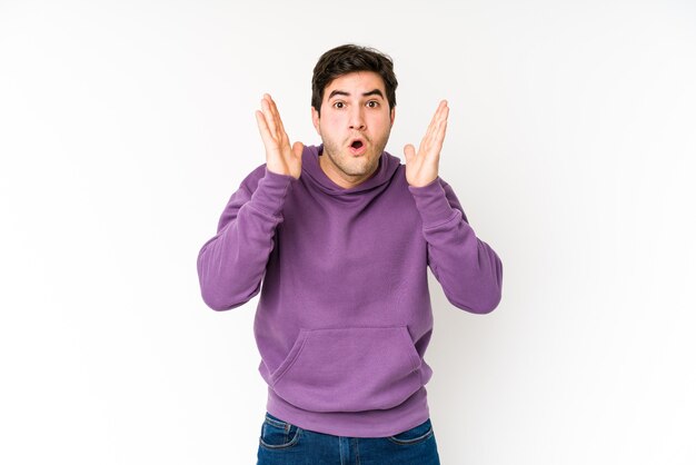 Young man isolated on white surprised and shocked.