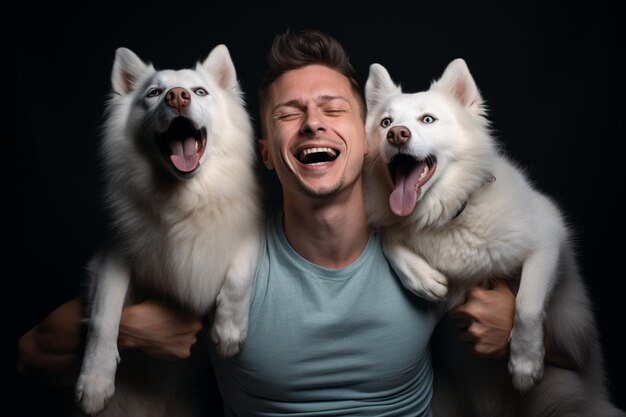 Photo young man laughing with two huskies dogs