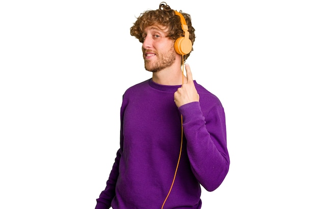 Young man listening to music with headphones