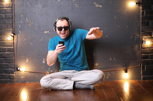 Young man listening to music with headphones