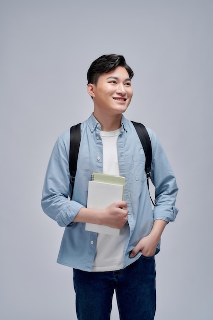 Young man looking extremely happy and surprised celebrating success shouting and jumping