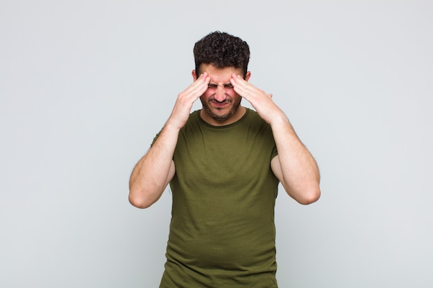 Young man looking stressed and frustrated