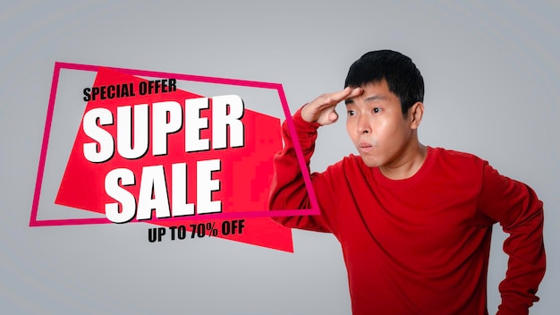 Young man looking SUPER SALE discount banner promotion