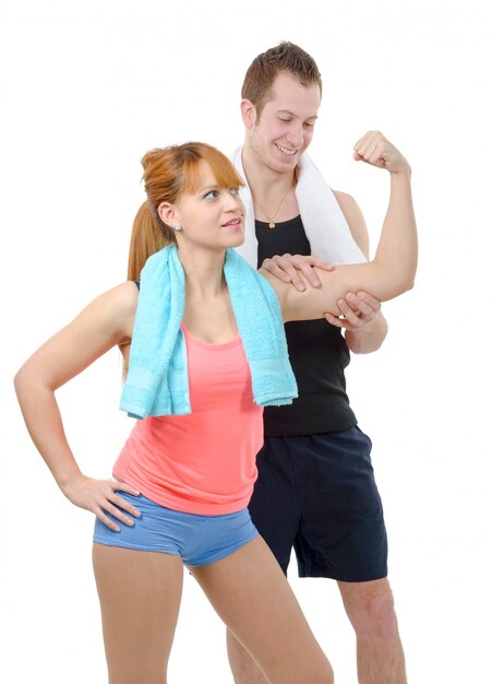 Photo young man looks at biceps of his girlfriend