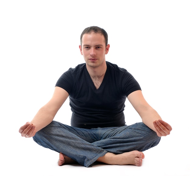 Photo young man in lotus position exercising yoga