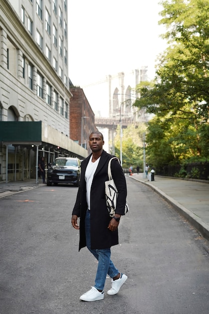 Young man outdoors exploring the city by himself