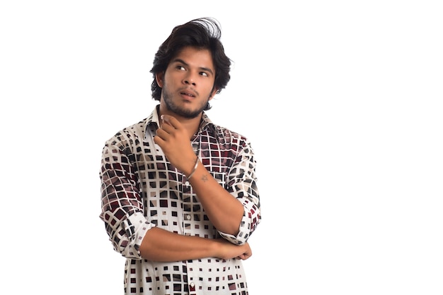 Young man posing on a white