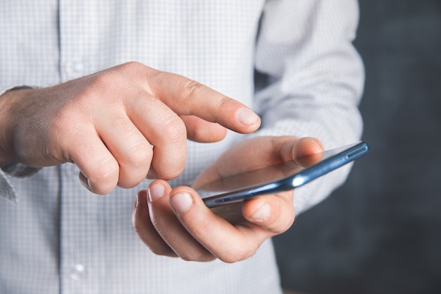 Young man pressing a phone sensor .