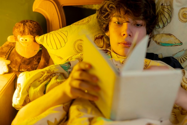 Young man read in bed before sleep b