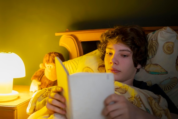 Young man read in bed before sleep b