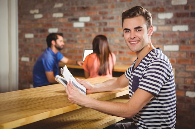  Young man reading a newspaper