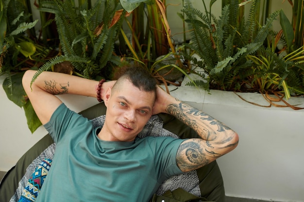 Young Man Relaxing in Armchair