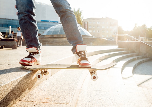 Young man riding a skateboard.