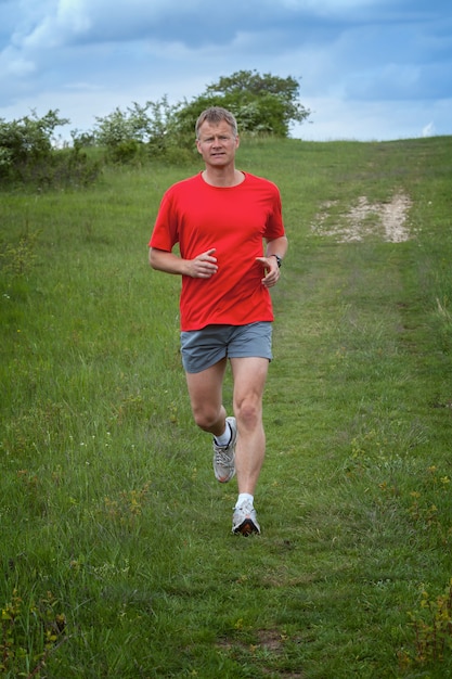 Young man running on the field