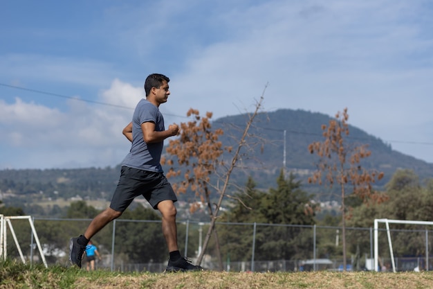 Young man running on a park  in mexico