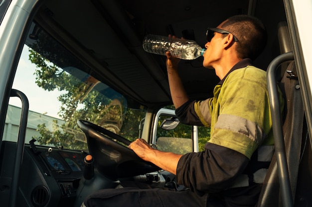 Young man saying it is everything okay a truck inside the cabin with the security clothes