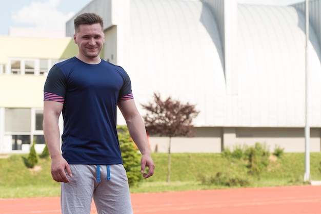 Young Man In Sports Clothing After Outdoor Exercises