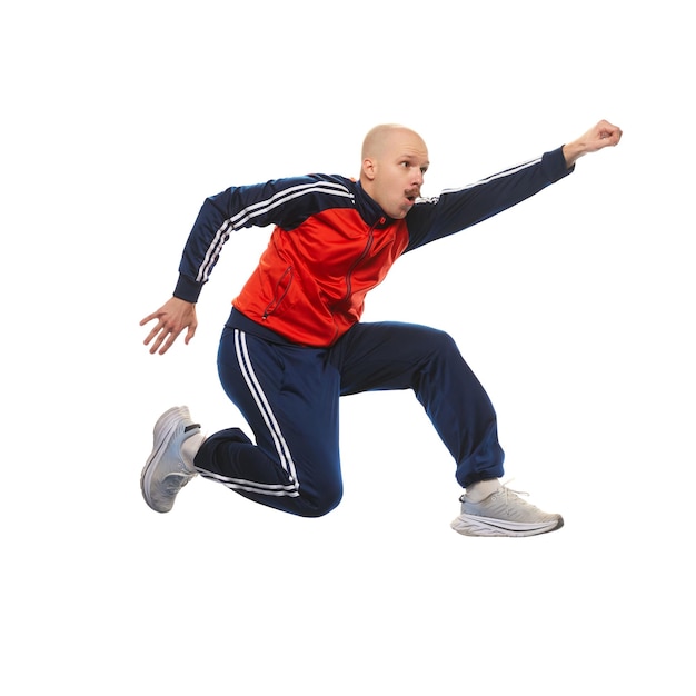 Young man in sportswear jumping in funny meme pose isolated on white background achievements