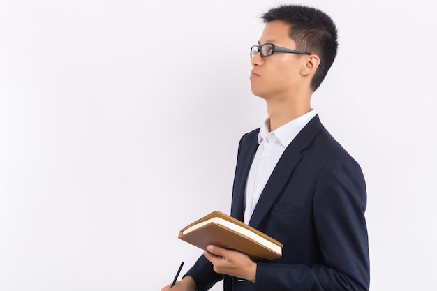 Young man standing with folder isolated on white background