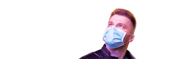 Young man in sterile face mask against corona virus