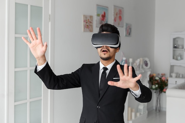 Young man in suit and virtual glasses d vision