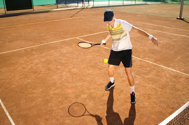 Young man on the tennis court