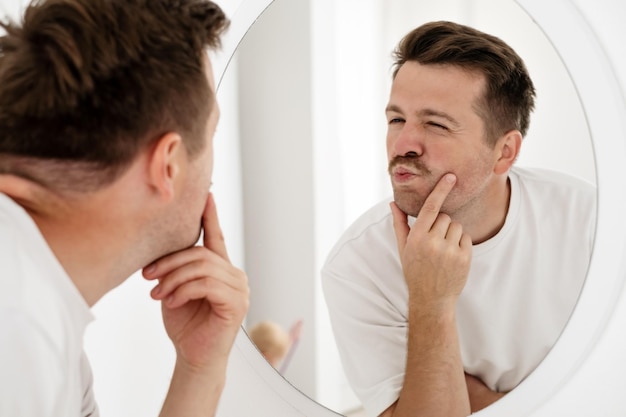 Young man trying to cheer himself up before a first date