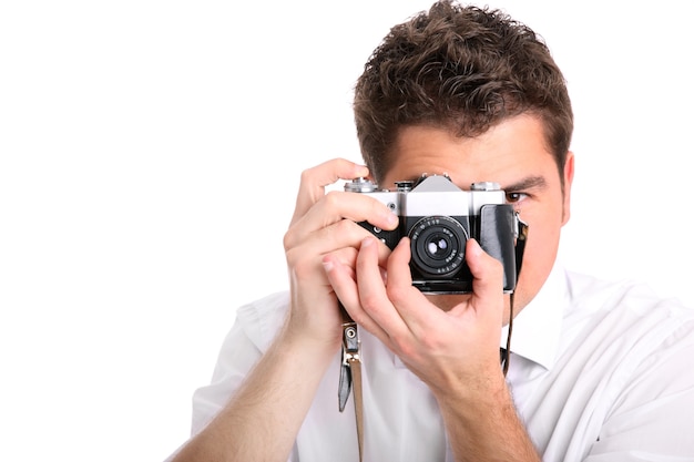 a young man trying to take a picture against white background