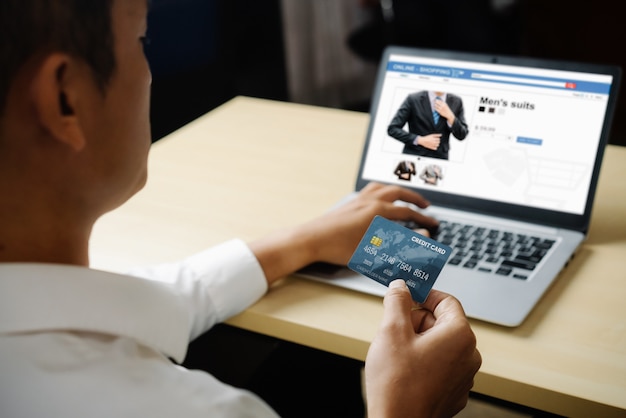 Young man use credit card for online shopping