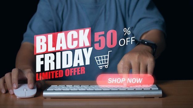 Young man using computer shopping online with discount banner promotion Ecommerce busin