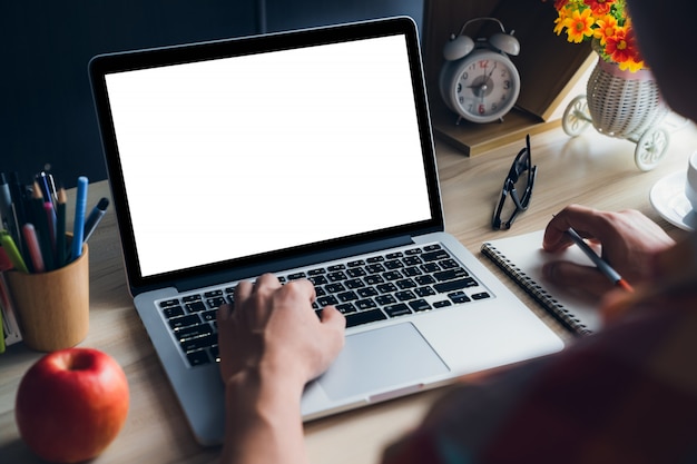 Young man using laptop at home