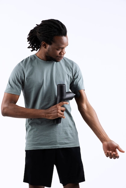 Young man using message gun