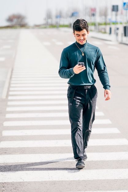 Young man using mobile cell phone