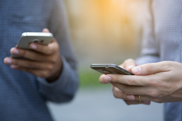 Young Man using mobile smart phone.