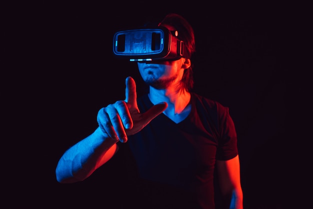 Young man using VR glasses