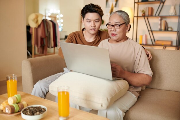 Young Man Visiting Grandmother