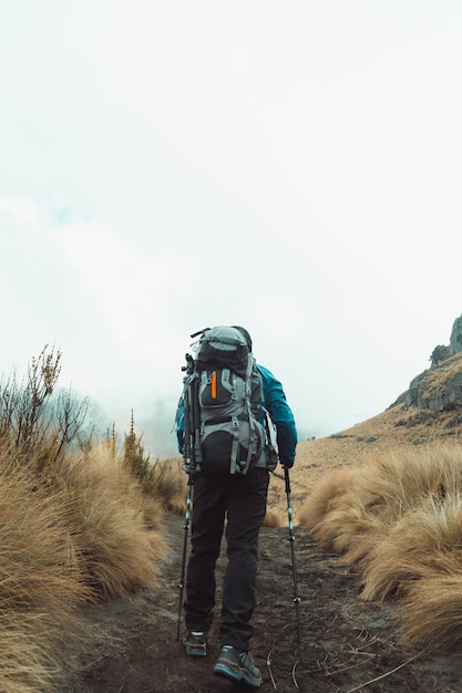 Young man walking in the mountain