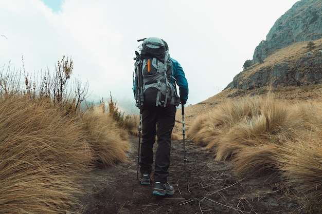 Young man walking in the mountain