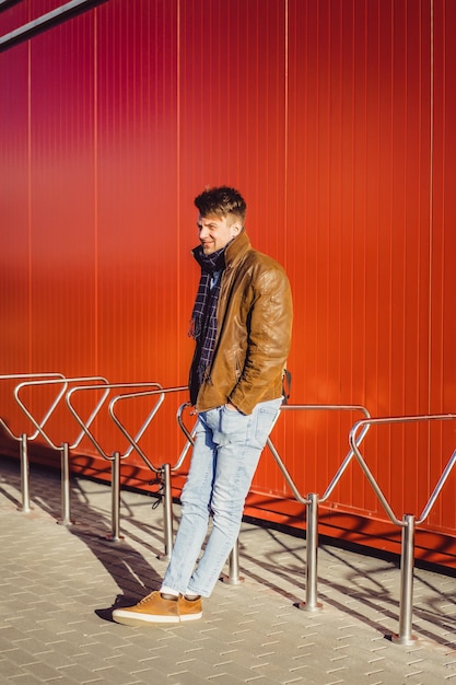 A young man walks around the city