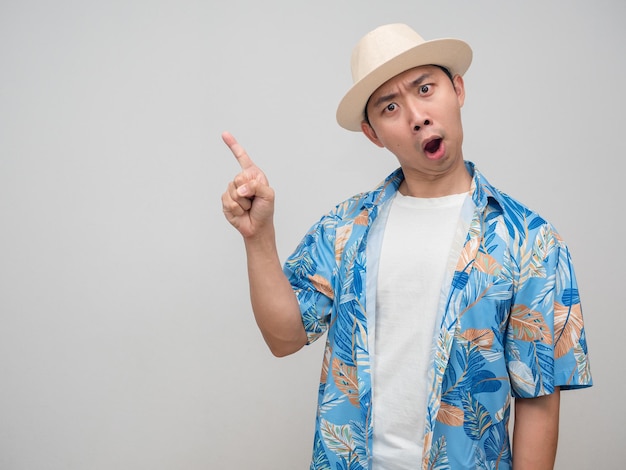 Young man wear hat beach shirt feels excited gesture point finger