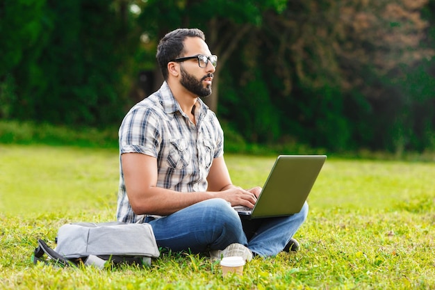 Young man wearing glasses sitting on