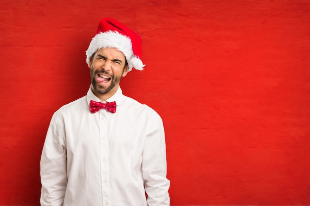 Young man wearing a santa claus hat on Christmas day