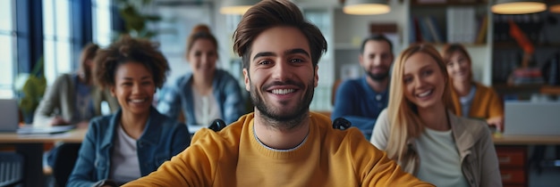 Young man in a wheelchair works with normal people with confidence in the office