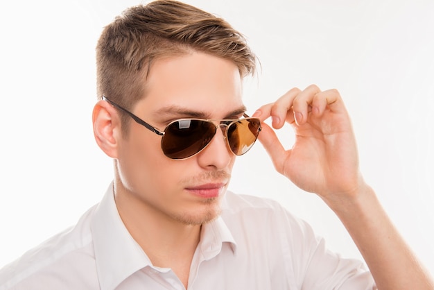 Young man in white shirt with sunglasses